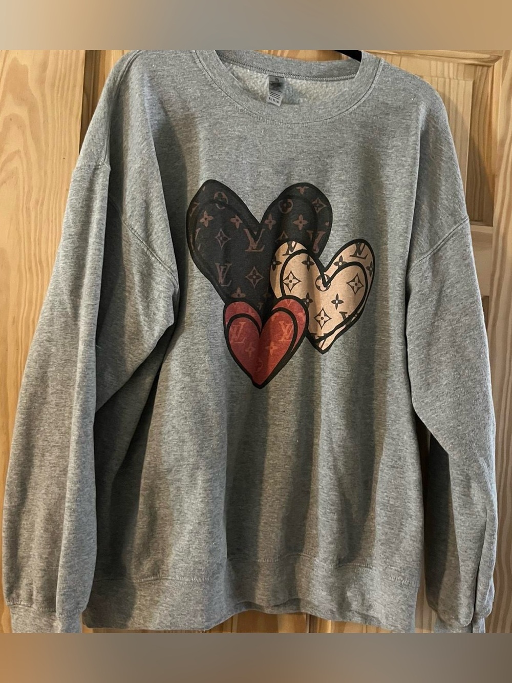 Trendy boutique Gray Sweatshirt with Black, Tan & Red Heart Motif